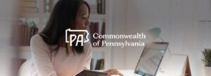 women in front of a notebook banner Commonwealth of Pennsylvania